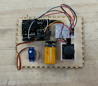 Circuit Design. Components include arduino, breadboard, joystick, and servo motor.