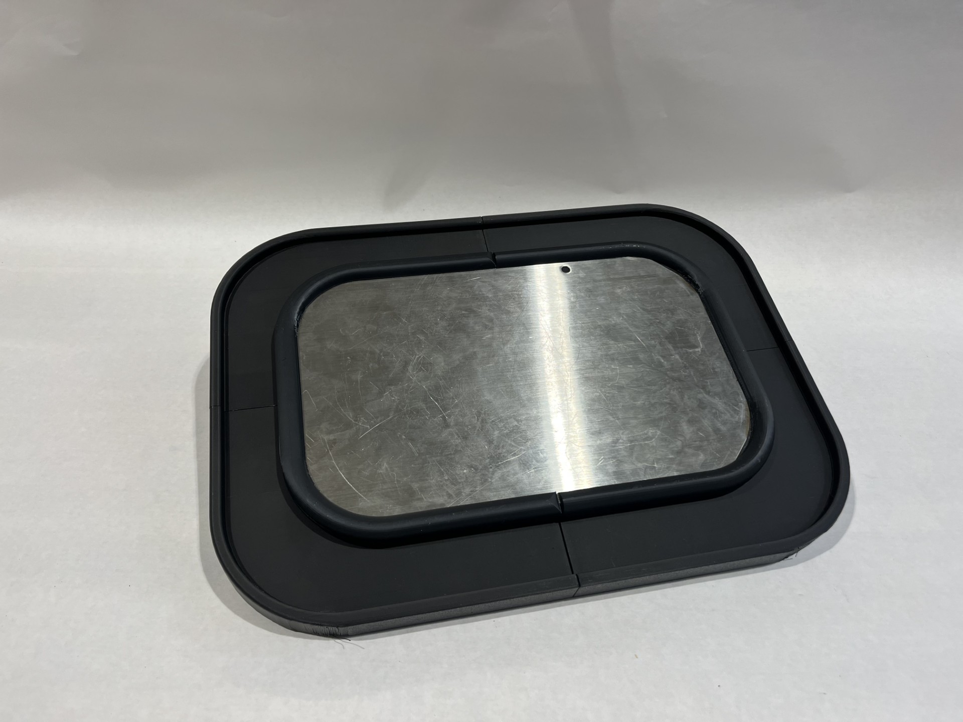 Stainless Steel was chosen for the bottom of the push plate, due to it's corrosion and odor resistance