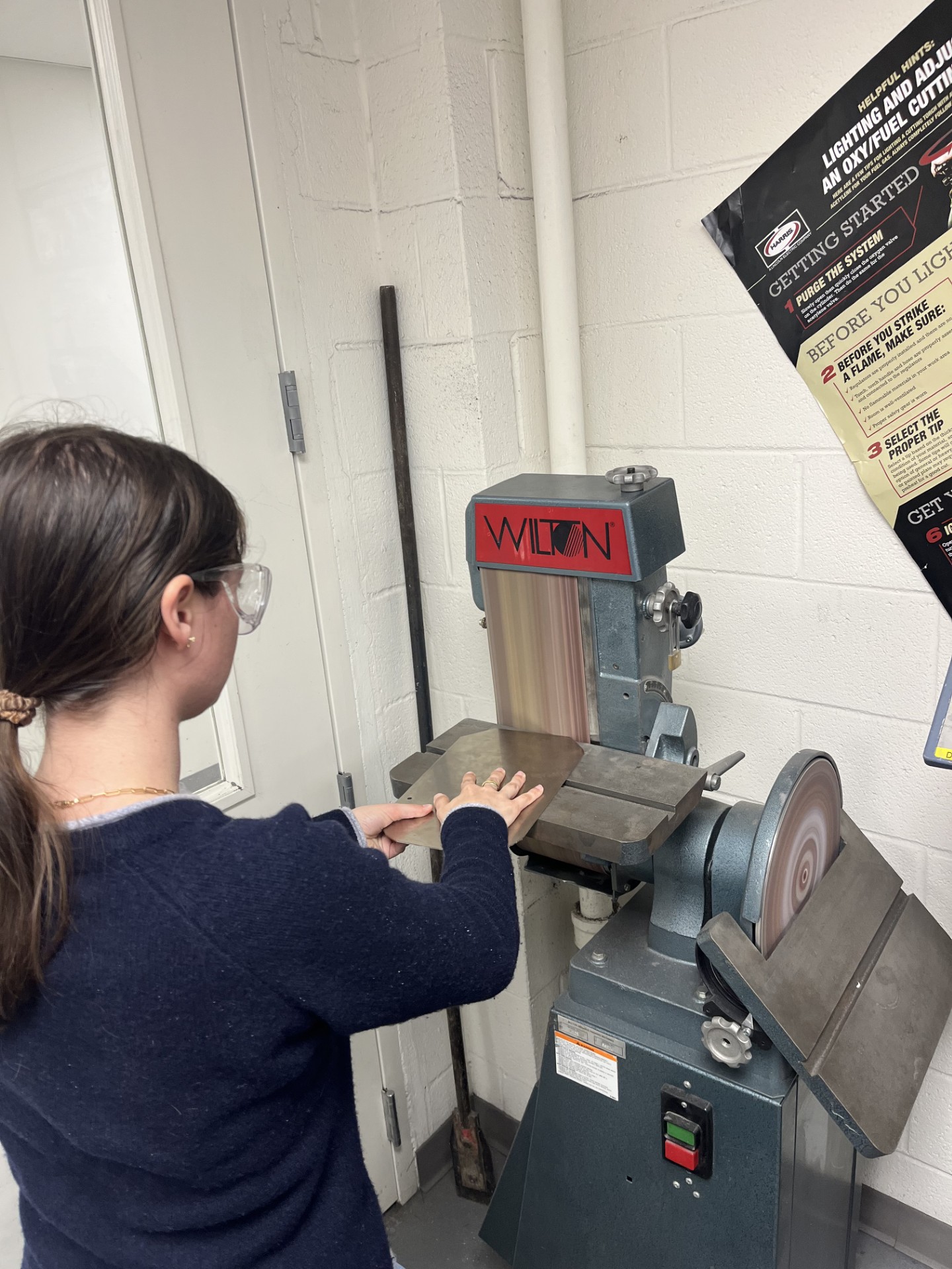 Gaining machine shop skills by sanding down stainless steel plate